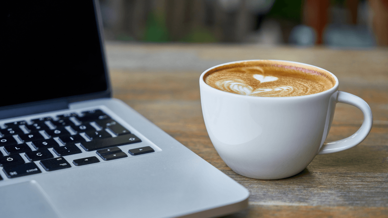 Laptop keyboard and coffee