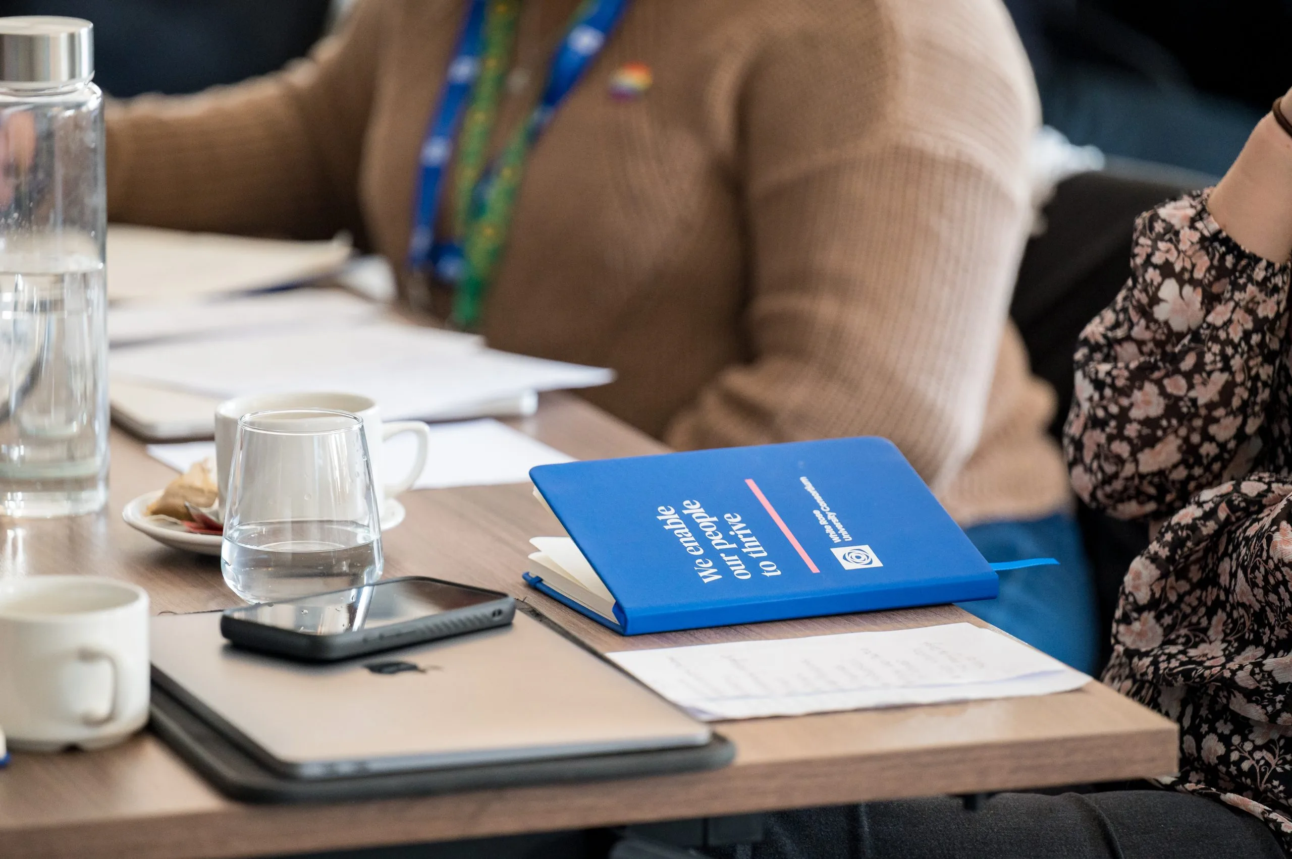 Blue book on table with glass of water