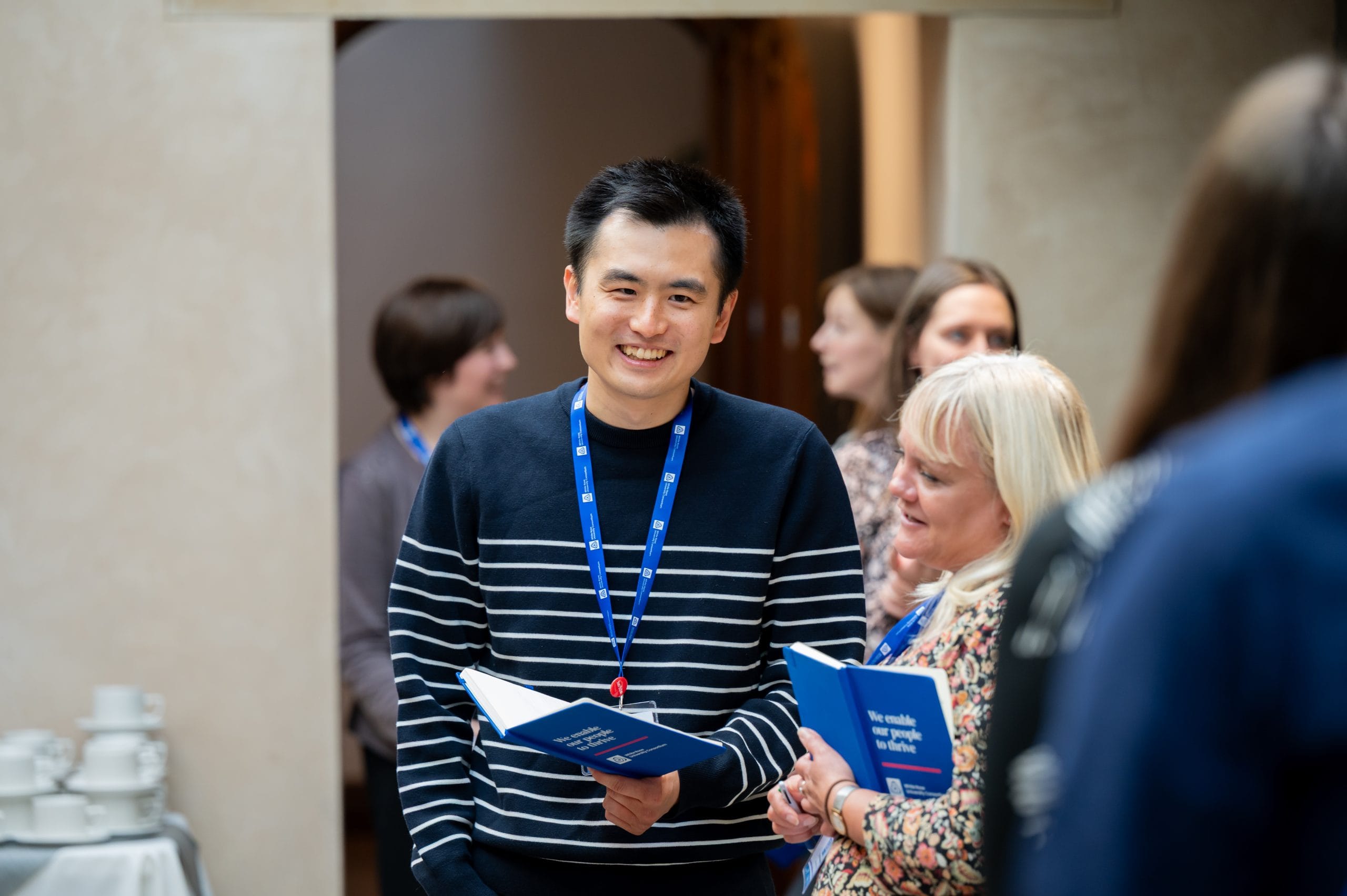 two. people standing and smiling